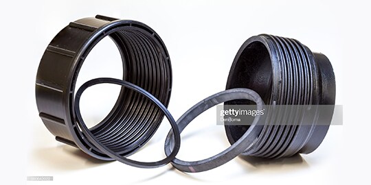 A black plastic rings with a ring in the middle

