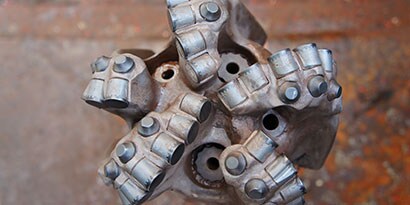 Oil drill bit with PDC components
