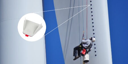 image of worker suspended in air installing 3M Vortex Generators
