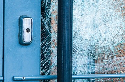 shattered window with broken glass in a commercial building