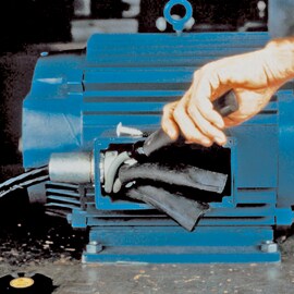 Open compartment of motor housing revealing electrical motor leads.