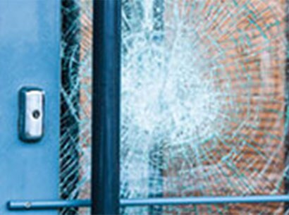 close-up of a broken glass door
