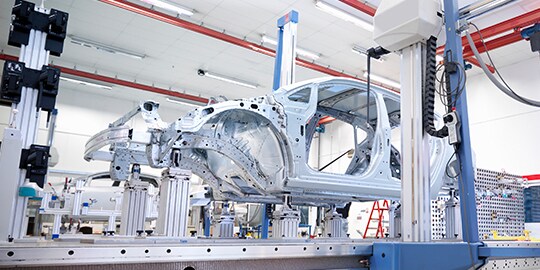 A car frame in a factory
