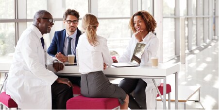 Health care professionals having an informal coffee meeting
