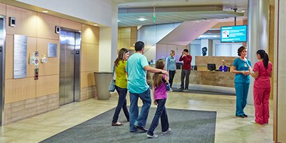 group of people walking in a lobby
