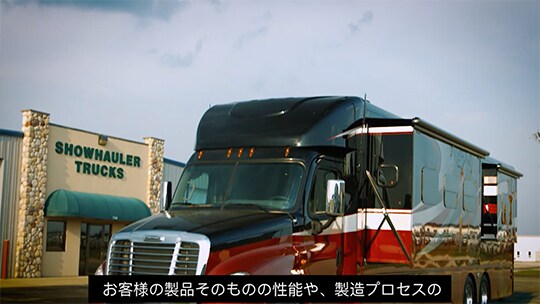 A truck parked in front of a building
