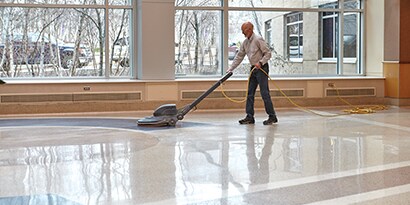 Man providing floor care with 3M products
