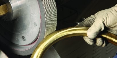 image of metal being polished
