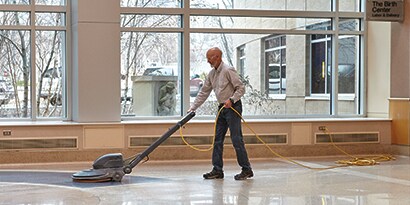 person using a vacuum cleaner

