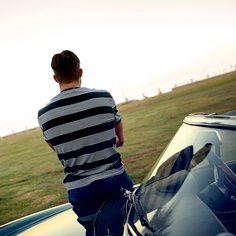 person standing on a car
