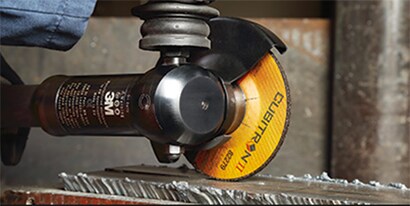 Grind wheel being used to back gouge metal 
