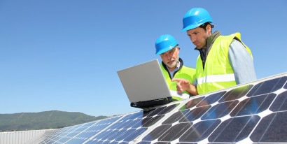 Engineers checking solar panel materials and setup
