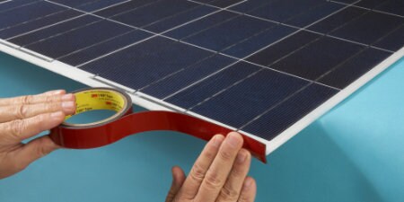 worker applying 3M Solar Tapes for solar light assembly
