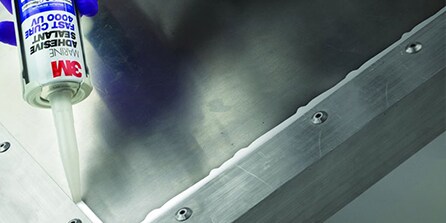 sealing adhesive being applied
