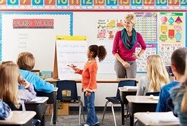teacher and student in classroom setting with 3M window film protection