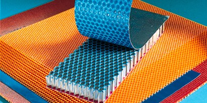 A close-up of a roll of blue and orange material
