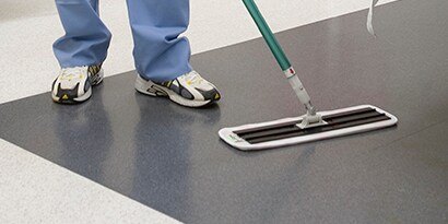person mopping the floor
