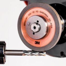 Round tool fluting with grinding wheel