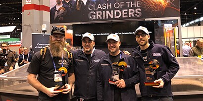 4 men holding trophies at 3M Clash of the Grinders
