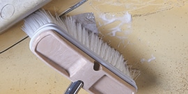 inside of fiberglass panel is cleaned before repairs begin
