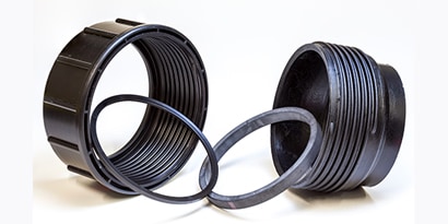 A black plastic rings with a ring in the middle
