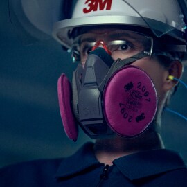 Woman using 3M Reusable Respirator