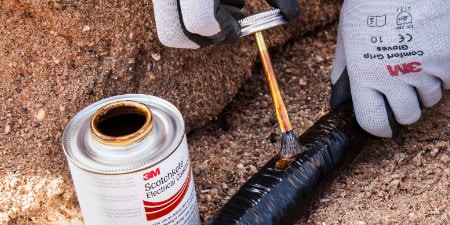 worker applying 3M Electrical FD to cable
