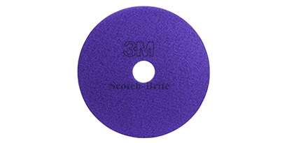 purple abrasive disc with a hole in the center
