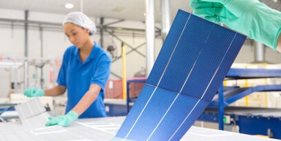Technicians following the solar panel manufacturing process
