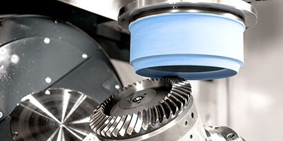 Gear grinding with single rib grinding wheel
