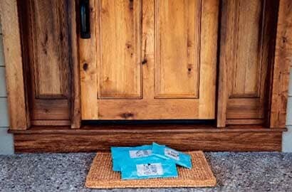 packages at a doorstep wrapped in Scotch™ Flex & Seal