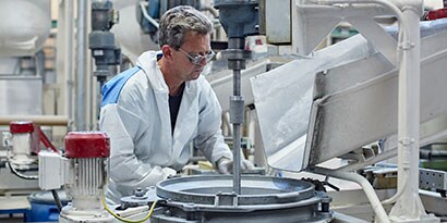 Man working in abrasives production plant
