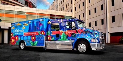 blue truck with flowers painted on it
