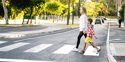 an image of pedestrians crossing the street
