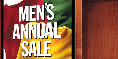 Sign wrapped in 3M printable film, labeled 'Men's Annual Sale'

