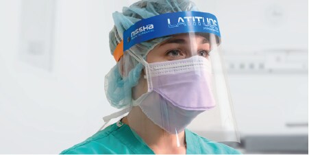 Doctor wearing a LATITUDE™ PLUS protective face shield with 3M™ Anti-Fog Face Shield Film 
