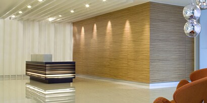 A reception desk in a lobby
