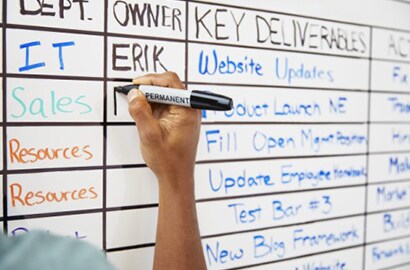 person writing on Post-it® Flex Write Surface