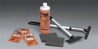 cleaning kit with a scouring brush and sponges
