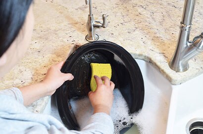Cleaning dishes with Scotch-brite sponge
